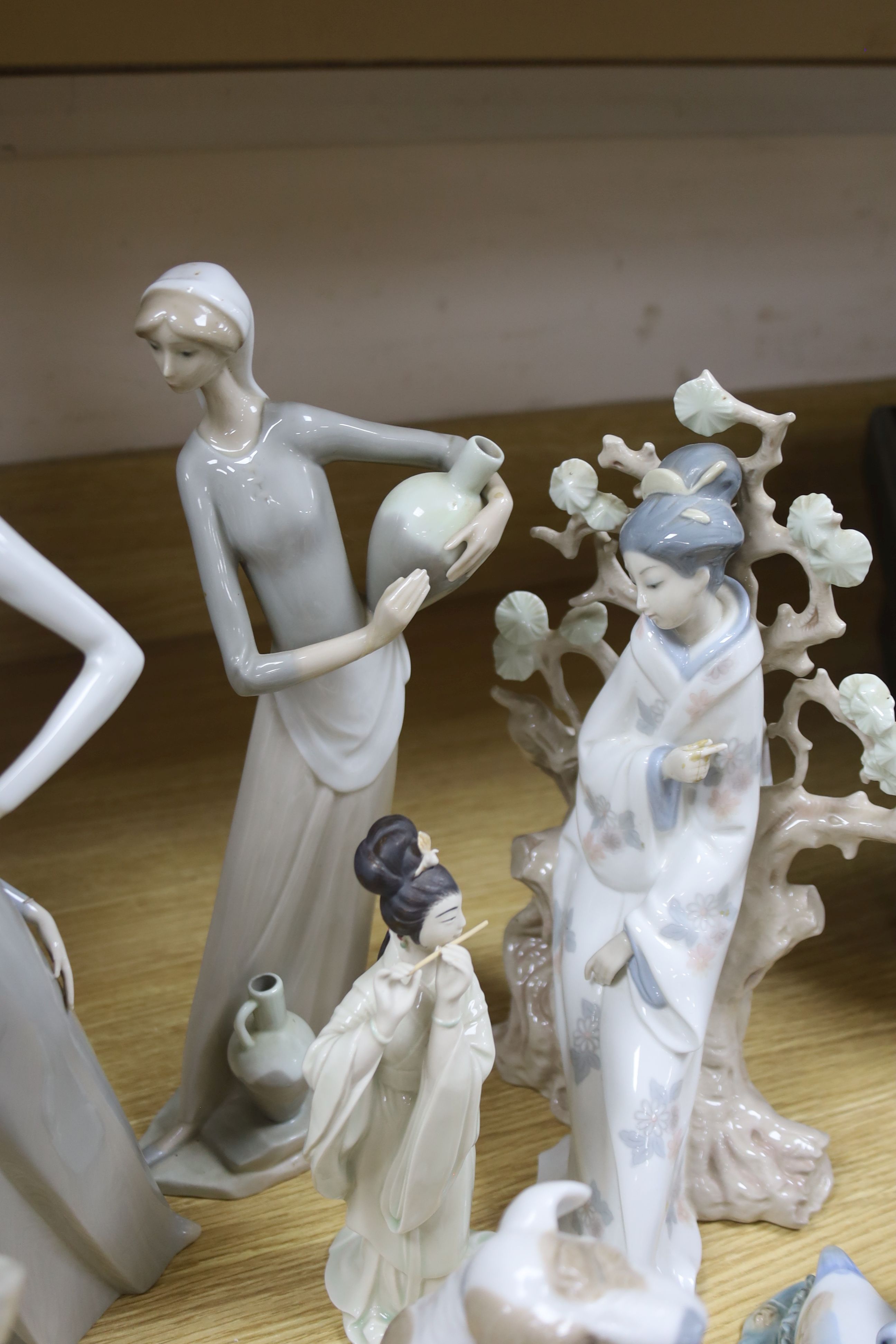 Four pieces of Lladro porcelain and assorted Nao etc (10)